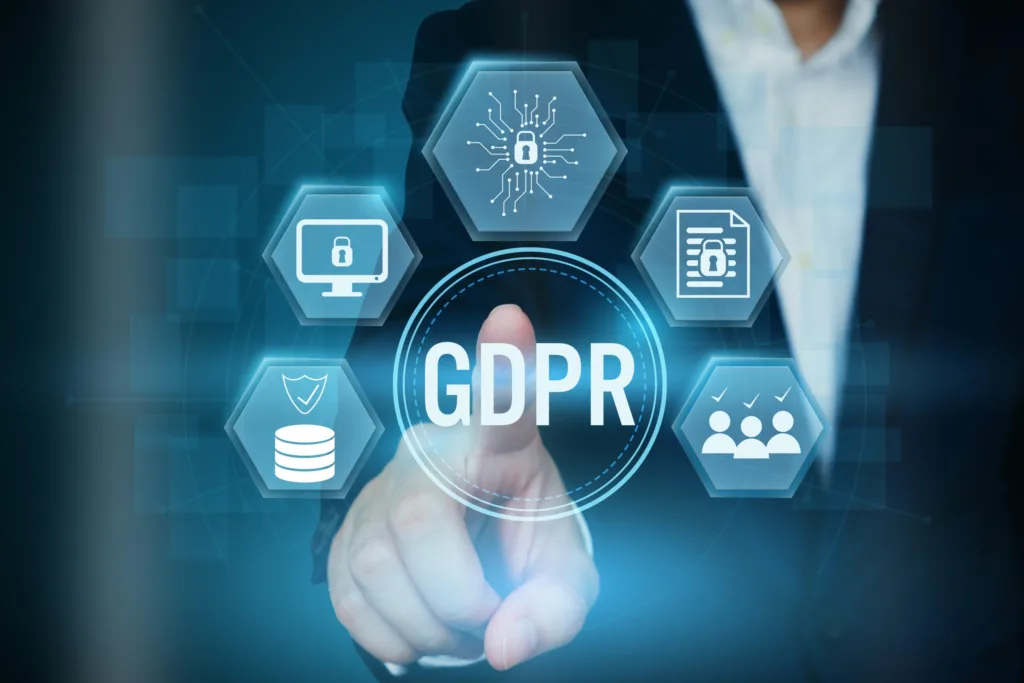 A hand reaching out to touch a GDPR button