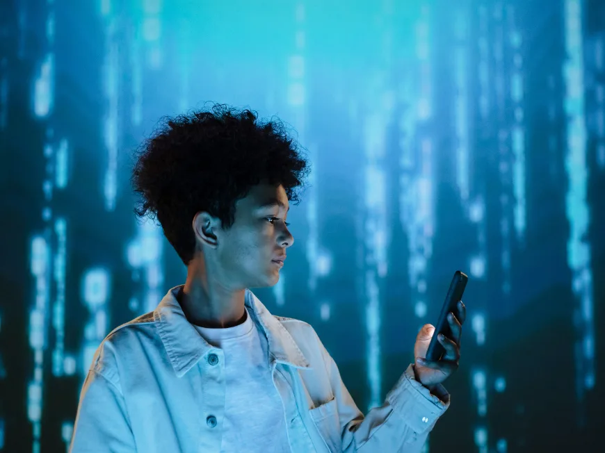 A person using a phone in front of a cyberspace background